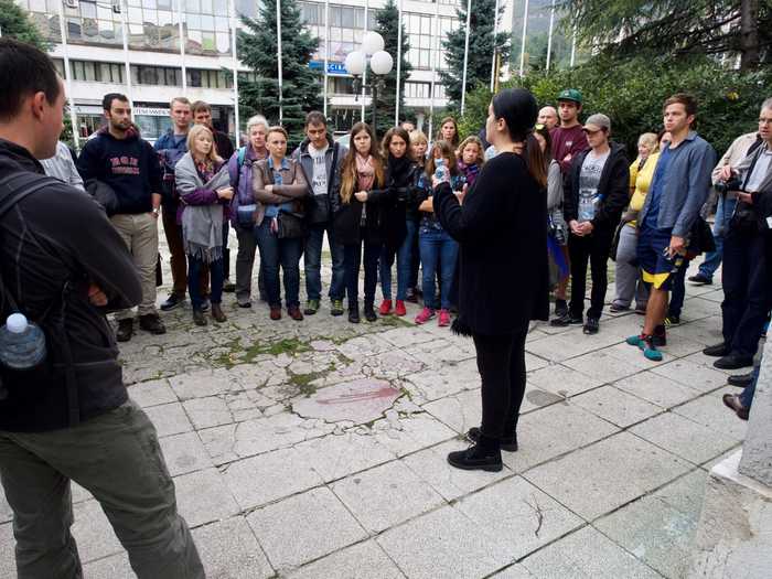 Our tour guide explaining the meaning behind the Sarajevo Rose