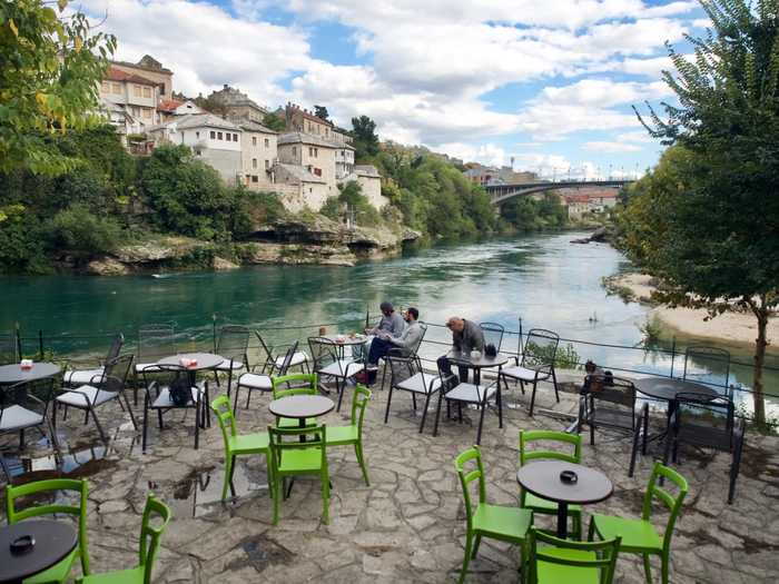 A coffee shop situated on the river in Mostar