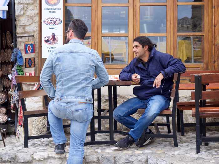 Men hanging out and drinking coffee