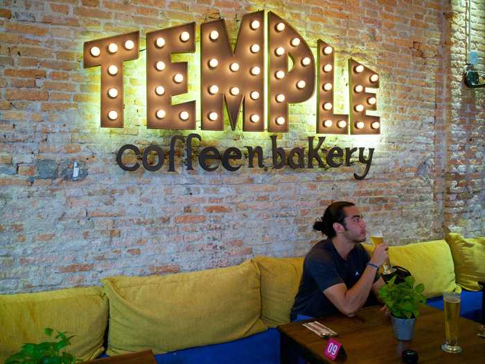 Gabe enjoying a coffee at the biggest coffee shop in Siem Reap