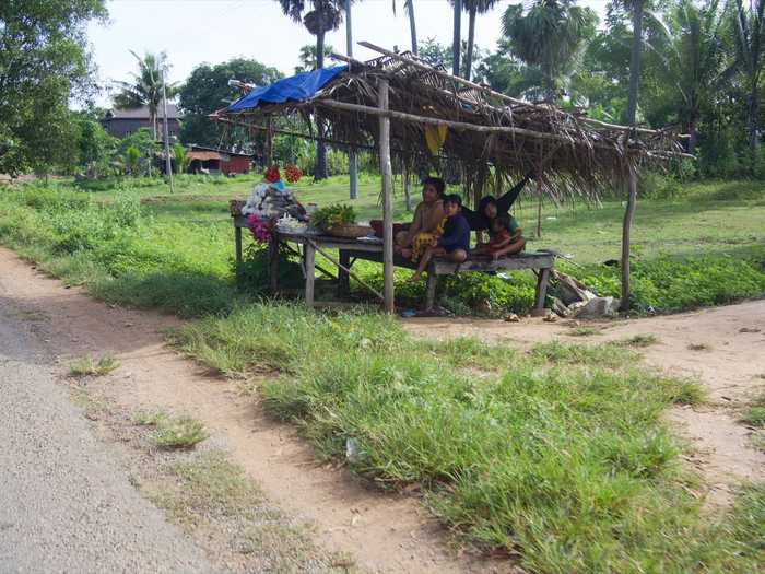 Small shops on the side of the road sell snacks and food and souveniers.