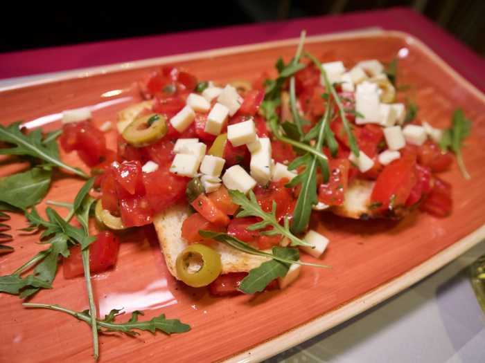 Fresh bread, tomatoes, cheese and arugula