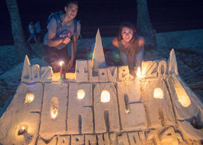 Local kids make sandcastles for tips.